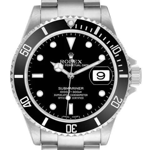 Black dial and aluminum bezel of a Rolex Submariner Date 16610