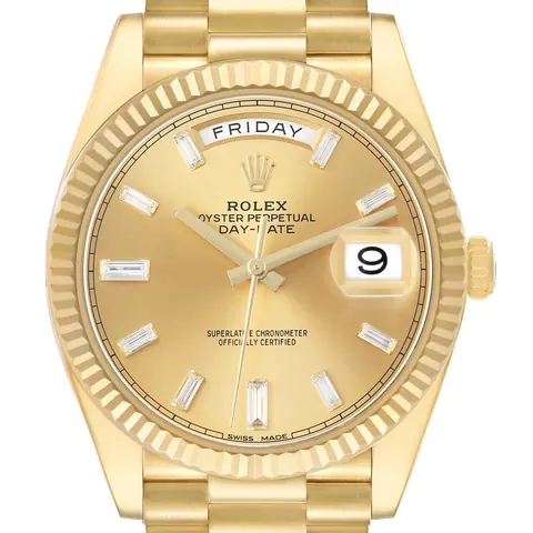 Champagne dial with day window of a Rolex Day-Date 40 228238 in yellow gold