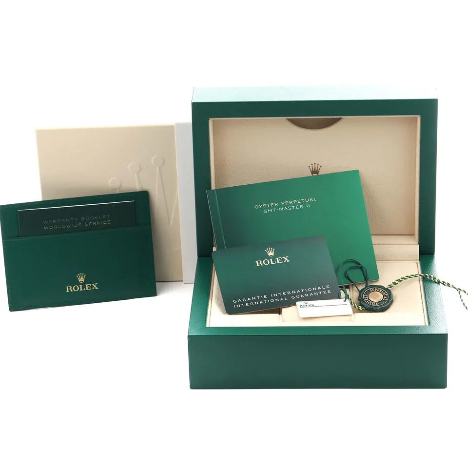 Green Rolex box with warranty card and booklet