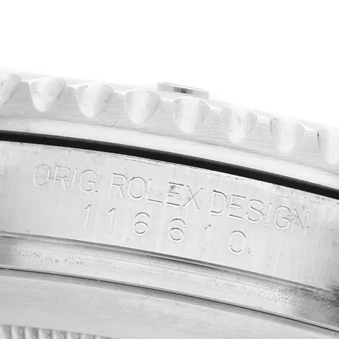 Reference number 116610 engraved between the lugs of a Rolex Submariner case